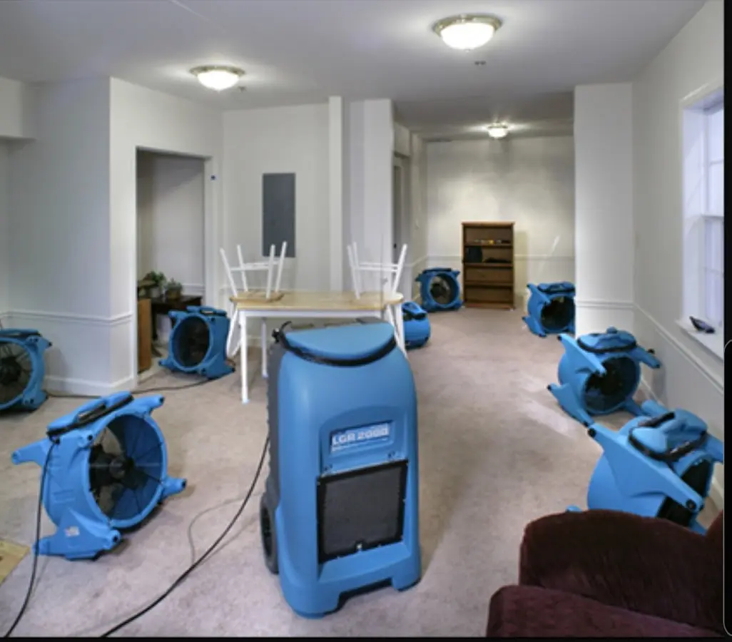 Air movers and dehumidifier setup for Water Damage Restoration in Hoschton